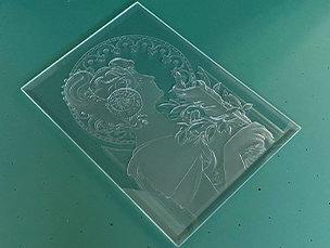 Chemicals are poured onto the carved glass surface to give it a luster